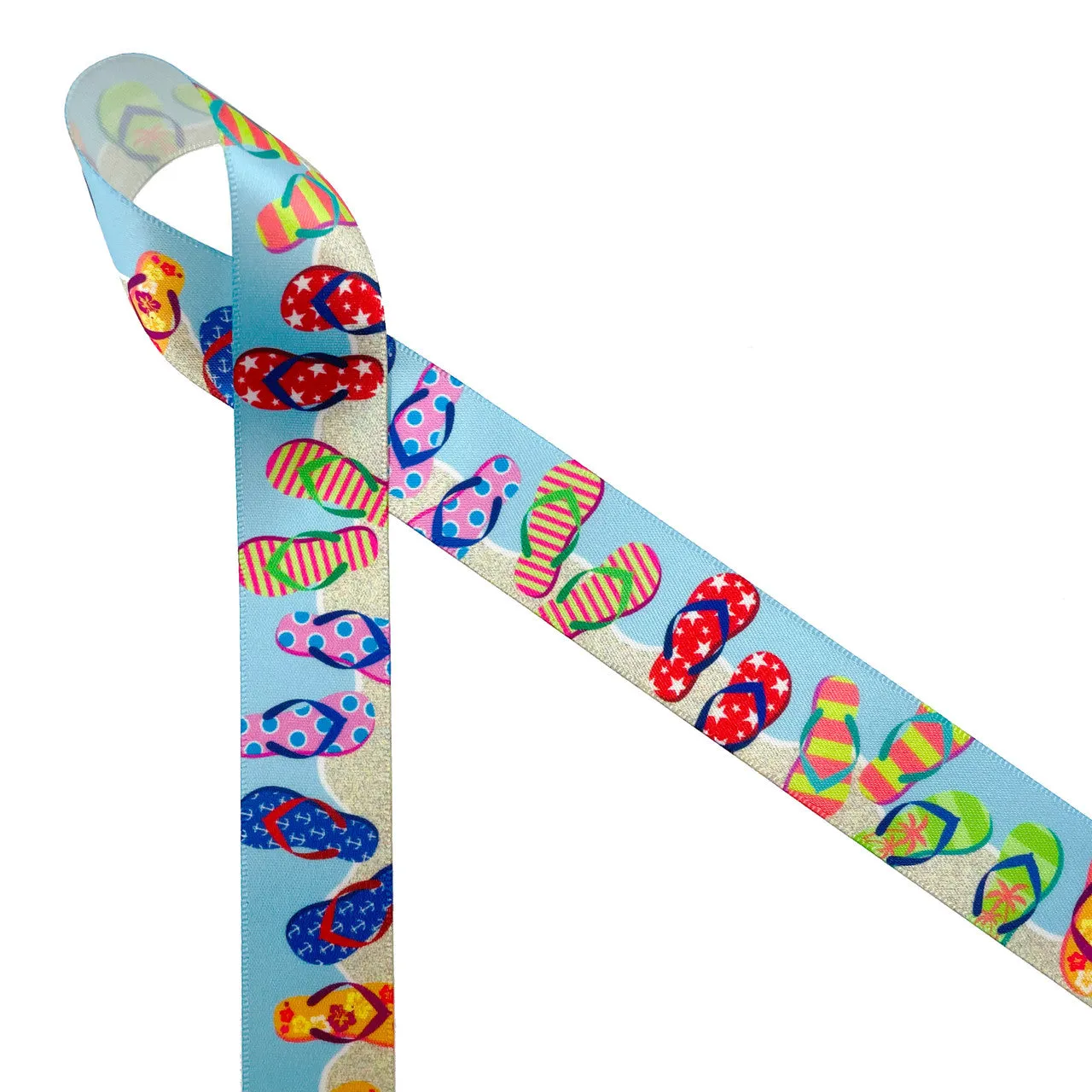 Flip Flop ribbon colorful flip flops in stripes, stars, and floral designs on a sand and blue background printed on  5/8" and 7/8" white single face satin